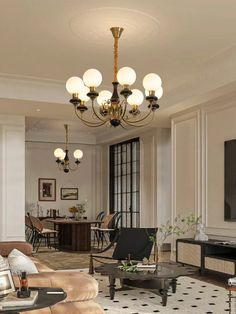 a living room filled with lots of furniture and a flat screen tv mounted on the wall