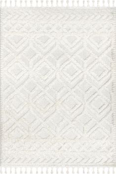 a white rug with tassels on the edges