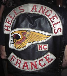 the back of a biker's leather jacket with an eagle and name on it