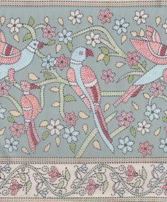 an embroidered design with two birds and flowers