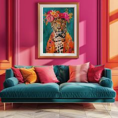 a living room with pink walls and a blue couch in front of a leopard painting