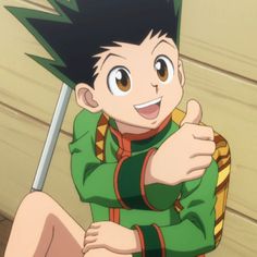 an anime character is giving the thumbs up sign with his right hand and sitting on the floor