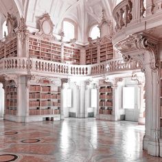 a large room with many bookshelves in it