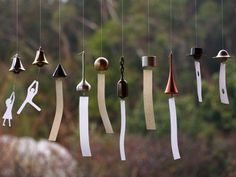 there are many different types of bells hanging from strings