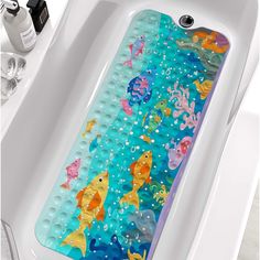 an iphone case with fish and bubbles in the water on a bathtub next to a sink