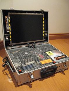 an open briefcase sitting on top of a hard wood floor