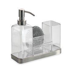 a clear soap dispenser with silver accents