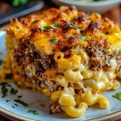 a close up of a plate of food with macaroni and cheese on it