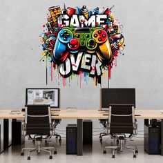 a wall decal that says game over with video game controllers on the front and back