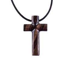 a wooden cross is hanging on a black cord