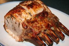 a piece of meat sitting on top of a white plate