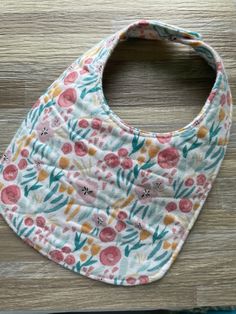 Each bib or burp cloth is made with a soft, 100% cotton flannel as a top and bottom layer with a third, absorbent layer in between. Bibs have a scooped neck line to fit your little one perfectly.  The outer edge of each bib or burp cloth is sewn down for added detail and durability. A plastic KAM snap is center on the back for an easy closure. (Snap color will coordinate with each bib)  Each item can be washed and dried. After drying, bibs can wrinkle up some and pull back out (they can also be Cotton Playtime Bib For Babies, Cute Cotton Bib For Playtime, Pink Cotton Bib Machine Washable, Pink Cotton Machine Washable Bib, Playful White Cotton Bib, Playful Cotton Bib, Machine Washable, Playful Cotton Bib Machine Washable, Cute Cotton Washable Bib, Cute Multicolor Machine Washable Bib