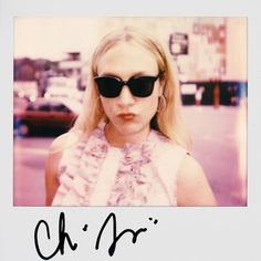 a girl with sunglasses on her face and the name ch'r