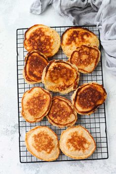 several pancakes cooling on a wire rack