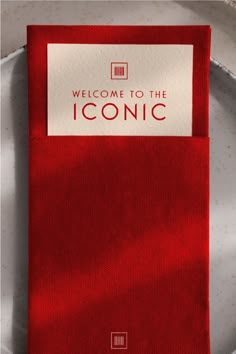 a red tie with the words welcome to the iconic on it's front and back