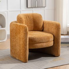 a chair sitting on top of a rug in a living room