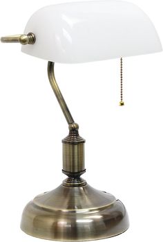 an antique brass desk lamp with a white glass shade