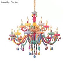 a colorful chandelier with candles hanging from it's center and the words luna light studios written below