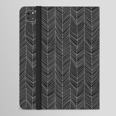 a black and white notebook with an abstract pattern