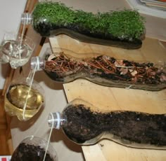 a table topped with wine glasses filled with different types of food and veggies