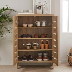 a wooden cabinet with shoes on it