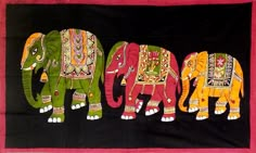 three elephants painted on a black background with pink border and red trim around the edges