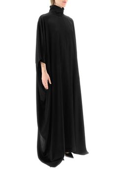 Long cape dress by Balenciaga crafted in viscose and cupro satin, featuring high neck, wide long kimono sleeves and rear zip fastening. The model is 177 cm tall and wears a size 1. Composition: 58% Viscose 42% Cu Silk Cape Kaftan, Elegant Draped Kaftan With Draped Sleeves, Elegant Oversized Abaya, Elegant Oversized Long Abaya, Elegant Long Oversized Abaya, Elegant Viscose Kaftan, Evening Satin Maxi Kaftan, Satin Maxi Length Evening Kaftan, Evening Satin Maxi Length Kaftan