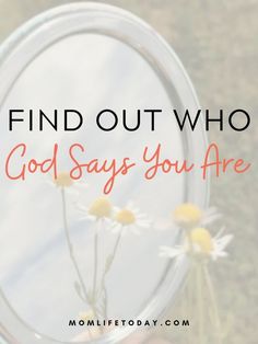 a hand holding a magnifying glass with daisies in it and the words find out who god says you are