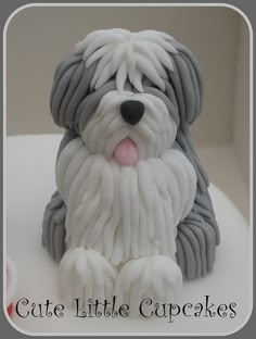 a cake shaped like a dog sitting on top of a table