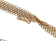 18k yellow gold mesh necklace by Elsa Peretti for Tiffany & Co, with open heart pendant. Retail $8300. DESIGNER: Tiffany & Co MATERIAL: 18k Gold GEMSTONES: None DIMENSIONS: Necklace is 29" long, heart is 34mm x 35mm. Necklace has no clasp/no opening. MARKED/TESTED: Tiffany & Co, Elsa Peretti, 750, Spain. WEIGHT: 23 grams CONDITION: Previously Owned, Excellent Condition. Mesh Necklace, Tiffany Jewelry, Elsa Peretti, Georg Jensen, Open Heart, Selling Jewelry, Estate Jewelry, Ring Bracelet, Tiffany & Co.