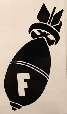 a black and white logo with the letter f in it's center, on top of a piece of paper