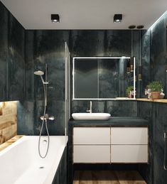 a bathroom with a tub, sink and mirror in the middle of it's walls