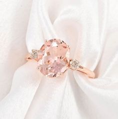 an image of a pink ring with diamonds on it