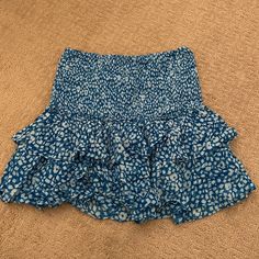 This Is A Perfect Skirt For The Beach Or For A Cute Brunch! Never Worn And Great Material! Casual Ruffled Skort For Vacation, Blue Stretch Summer Skirt, Blue Mini Length Bottoms For Brunch, Blue Ruffled Skirt For Summer, Blue Flowy Mini Skirt For Brunch, Flowy Blue Mini Skirt For Brunch, Blue Ruffled Skirt For Brunch, Blue Tiered Skirt For Day Out, Blue Mini Skirt Bottoms For Summer