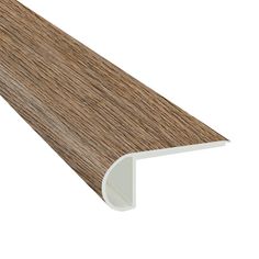 a close up view of the edge of a wooden flooring board with white trim