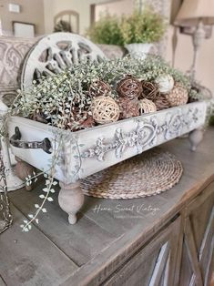 a white tray filled with plants on top of a wooden table