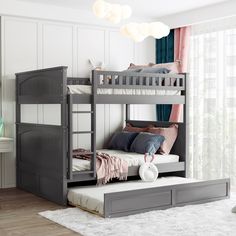 there is a bunk bed with two sets of drawers on the bottom and one side