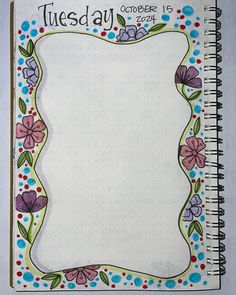 an open notebook with the words tuesday written on it and colorful flowers around the edges