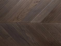 an image of wood flooring that looks like herringbones or chevron boards