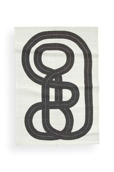 a black and white towel with the letter b in it's center, on a white background