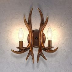 Add character to the walls of your bathroom, porch, or study with this eye-catching antler vanity light. The antlers have a rustic, wooden look and the candle-style lights project upwards whilst sitting on a curved antler edge. Making of iron and resin, with a round backplate, it is composed of two independent antlers. Besides, it has two bulb bases, and each bulb base can support a bulb with a maximum of 60W(Bulb is not included). Two lights will provide you with an ambient source of lighting, creating a cozy atmosphere. Two years warranty is included. Features: uD835uDC14uD835uDC0DuD835uDC08uD835uDC10uD835uDC14uD835uDC04 uD835uDC12uD835uDC13uD835uDC18uD835uDC0BuD835uDC04 uD835uDC00uD835uDC0DuD835uDC03 uD835uDC03uD835uDC04uD835uDC12uD835uDC08uD835uDC06uD835uDC0D: Hand-stained and antiqued Rustic Vanity Lights, Iron And Resin, Porch Bedroom, Rustic Vanity, Antler Wall, Vanity Art, Rustic Sconces, Living Room Farmhouse, Deer Horn