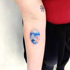 a person with a tattoo on their arm