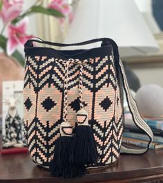 -Large Crossbody Wayuu Handbag,wayuu  bag, bohemian style, ethnic pattern -Original handmade Wayuu mochila bag that will go with any outfit. -The stunning, one-of-a-kind, 100% handmade crossbody has been carefully crocheted.  You can adjust the strap with a knotting it. This is an unique high-quality crochet bag which contain a beautiful color combination and tribal patterns  -This beautiful Wayuu bag that was carefully crafted using a single thread technique, which is the most traditional croch Bohemian Backpack In Natural Color For Everyday Use, Bohemian Style Natural Color Backpack For Everyday Use, Bohemian Beige Backpack, Bohemian Bucket Bag With Weaving For Everyday Use, Bohemian Tote Backpack With Adjustable Strap, Bohemian Tote Backpack For Daily Use, Bohemian Weave Bucket Bag For Everyday Use, Bohemian Weaving Bucket Bag For Everyday Use, Bohemian Crochet Travel Bag With Adjustable Strap