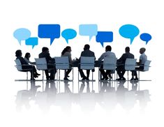 several people sitting at a table with speech bubbles above them