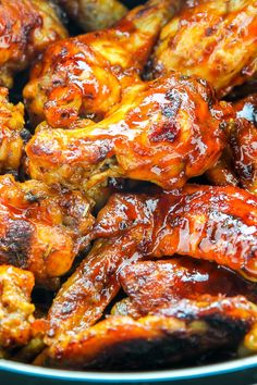 chicken wings covered in bbq sauce in a pan