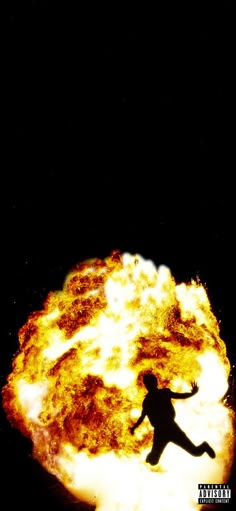 a person standing in front of a fireball