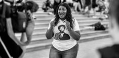 a black and white photo of a woman yelling