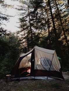 a tent is pitched up in the woods