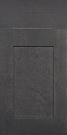 a black kitchen cabinet door with an open square design on the front and side panel