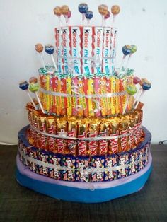 a cake made out of candy bars and lollipops